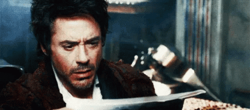 Sherlock Holmes Reading A Newspaper GIF