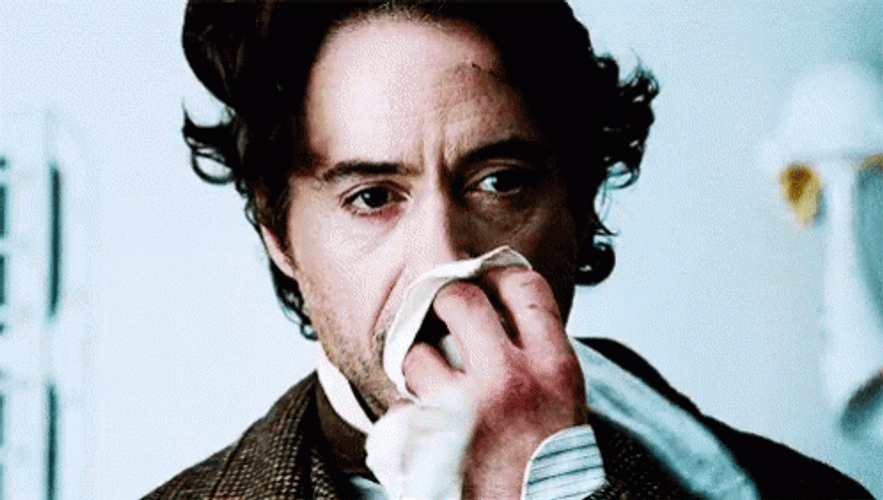 Sherlock Robert Downey Covering Nose GIF