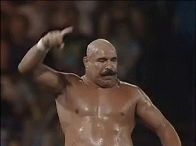 Shirtless Bald Man With Mustache In Wrestling Ring GIF