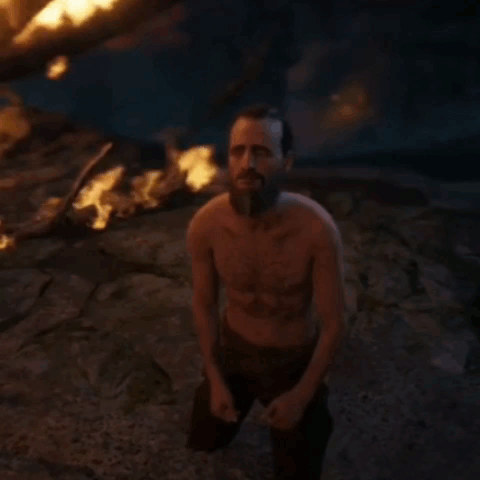 Shirtless Bearded Man Holding Sword At Fire GIF
