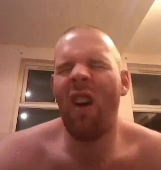 Shirtless Bearded Man Making Funny Face Eyes Closed