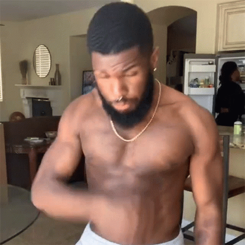 Shirtless Bearded Man with Gold Chain