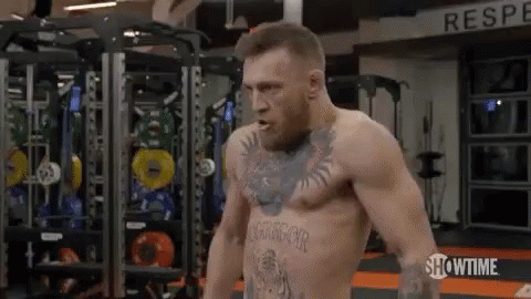 Shirtless Boxer Standing in Gym