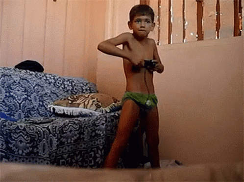 Shirtless Boy Playing Video Game With Controller
