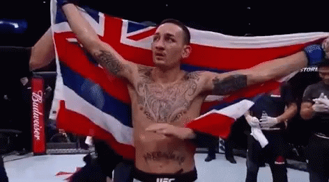 Shirtless Fighter Holding British Flag