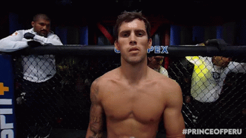Shirtless Fighter in Cage with Prince of Peru Hashtag