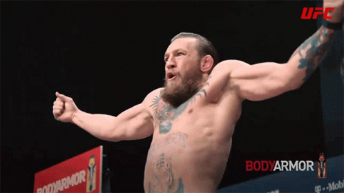 Shirtless Fighter in Front of Bodyarmor Sign