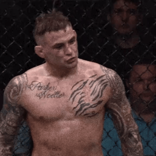 Shirtless Fighter With Chest Tattoo In Cage GIF