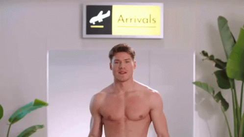 Shirtless Man at Airport Arrivals Sign