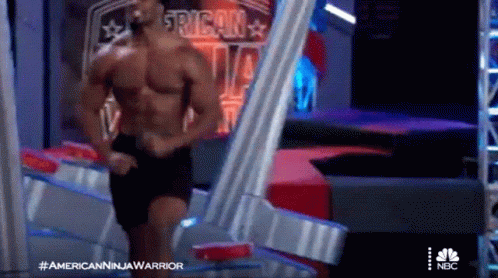 Shirtless Man At American Ninja Warrior Sign GIF
