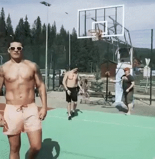 Shirtless Man at Basketball Net