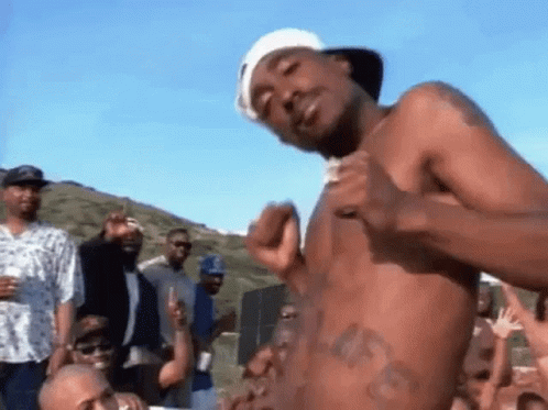 Shirtless Man Before Crowd Of Men GIF
