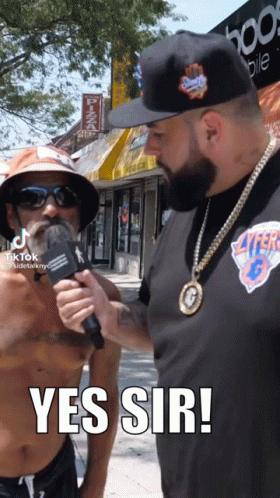 Shirtless Man Being Interviewed