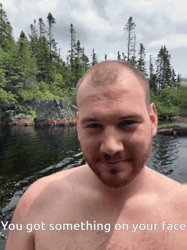 Shirtless Man by Water Saying You Got Something on Your Face