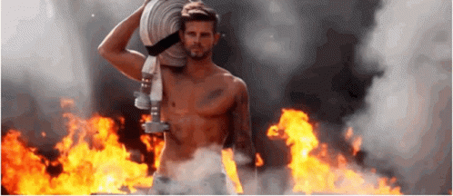 Shirtless Man Carrying Fire Hose