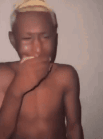 Shirtless Man Covering Mouth With Hand