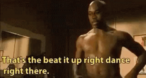 Shirtless Man Dancing in Dark Room