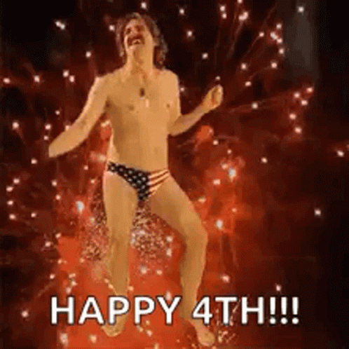 Shirtless Man Dancing in Front of Fireworks