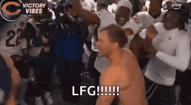 Shirtless Man Dancing In Front Of Football Players GIF