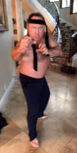 Shirtless Man Dancing In Hallway With Stairs GIF