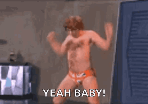 Shirtless Man Dancing in Orange Underwear