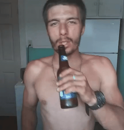 Shirtless Man Drinking Bottle of Beer