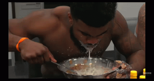 Shirtless Man Eating Cereal