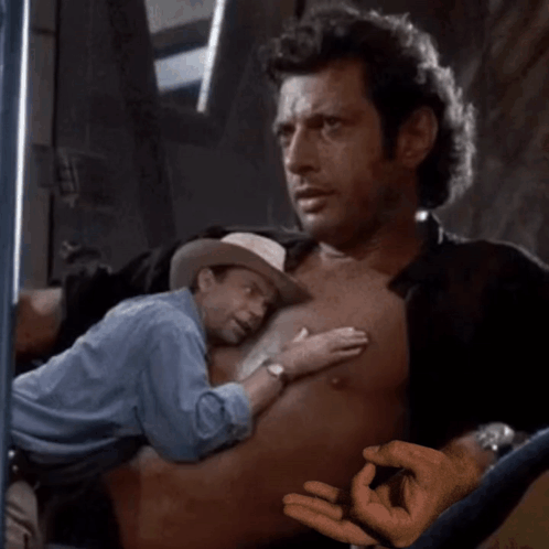 Shirtless Man Held by Man in Cowboy Hat