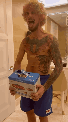 Shirtless Man Holding Box Saying Happy Bed