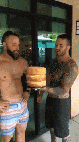 Shirtless Man Holding Cakes GIF