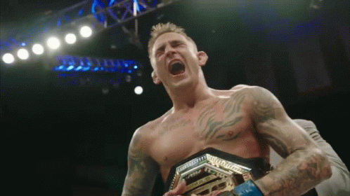 Shirtless Man Holding Championship Belt Screaming GIF