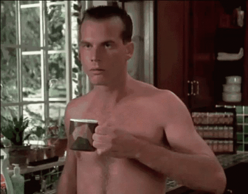 Shirtless Man Holding Coffee