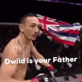 Shirtless Man Holding Flag in Boxing Ring