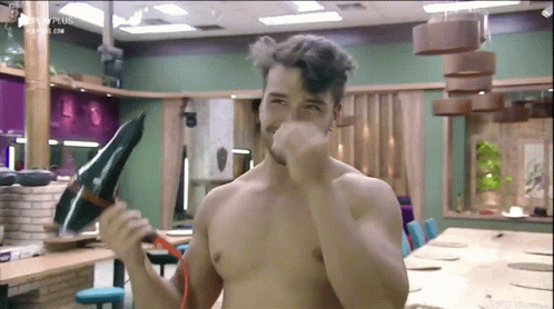 Shirtless Man Holding Hair Dryer
