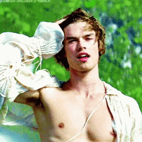 Shirtless Man Holding Head