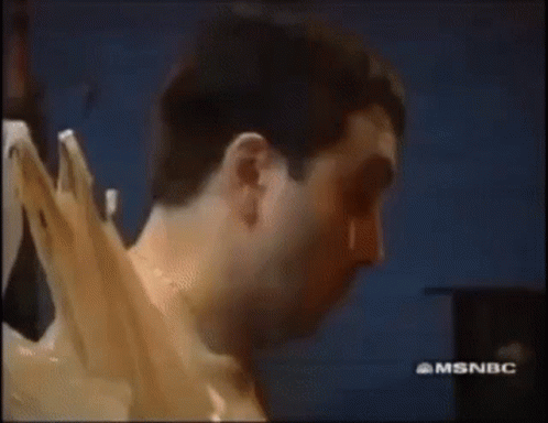 Shirtless Man Holding Plastic Bag