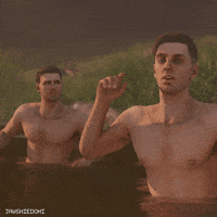 Shirtless Man in Bathtub With Females On Chest