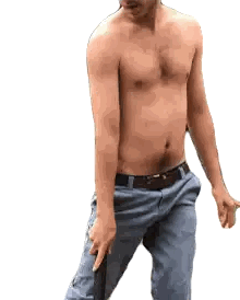 Shirtless Man in Blue Pants Holding Black Object