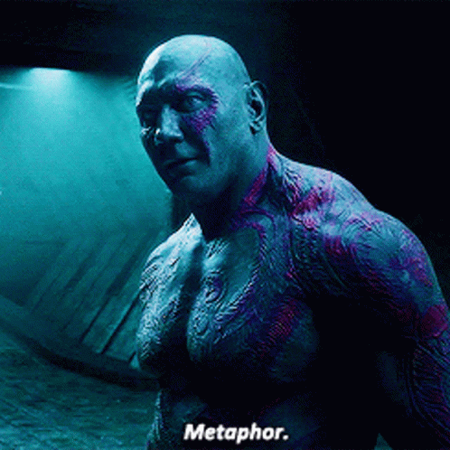 Shirtless Man in Dark Room Saying Metaphor