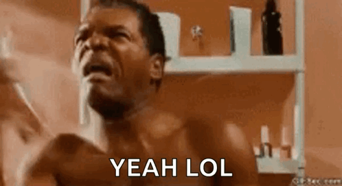 Shirtless Man In Front Of Bathroom Shelf GIF
