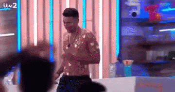 Shirtless Man in Front of Crowd
