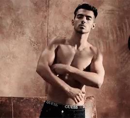 Shirtless Man In Guess Underwear Arms Crossed GIF