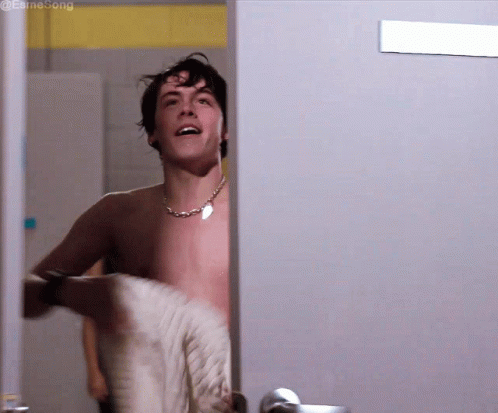 Shirtless Man in Locker Room