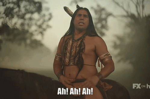 Shirtless Man in Native American Outfit Says Ah Ah Ah