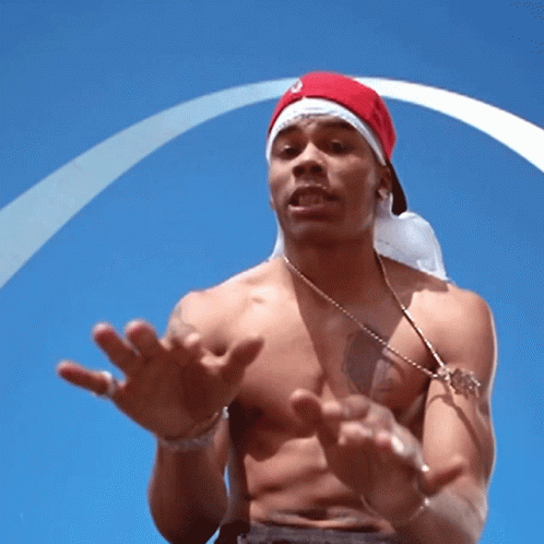 Shirtless Man in Red Hat and White Bandana