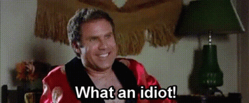 Shirtless Man in Red Robe Smiling Saying What an Idiot