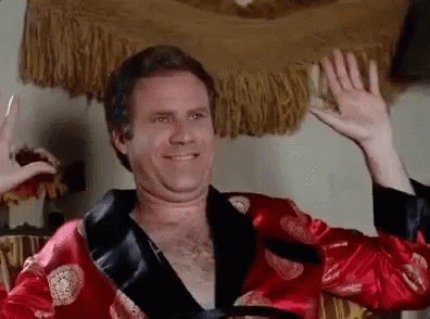 Shirtless Man in Red Robe Waving