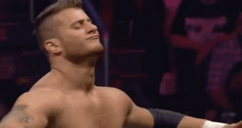 Shirtless Man in Ring Arms Outstretched