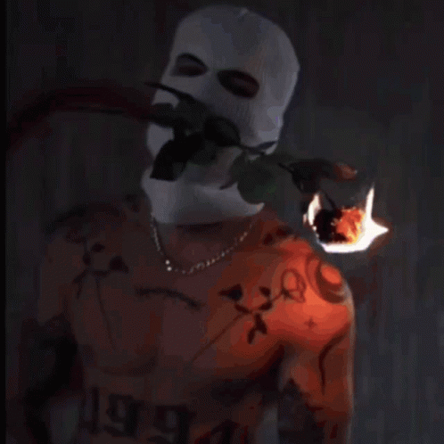 Shirtless Man in Ski Mask With Tattoo Number 44