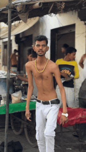 Shirtless Man in White Pants and Gold Chain